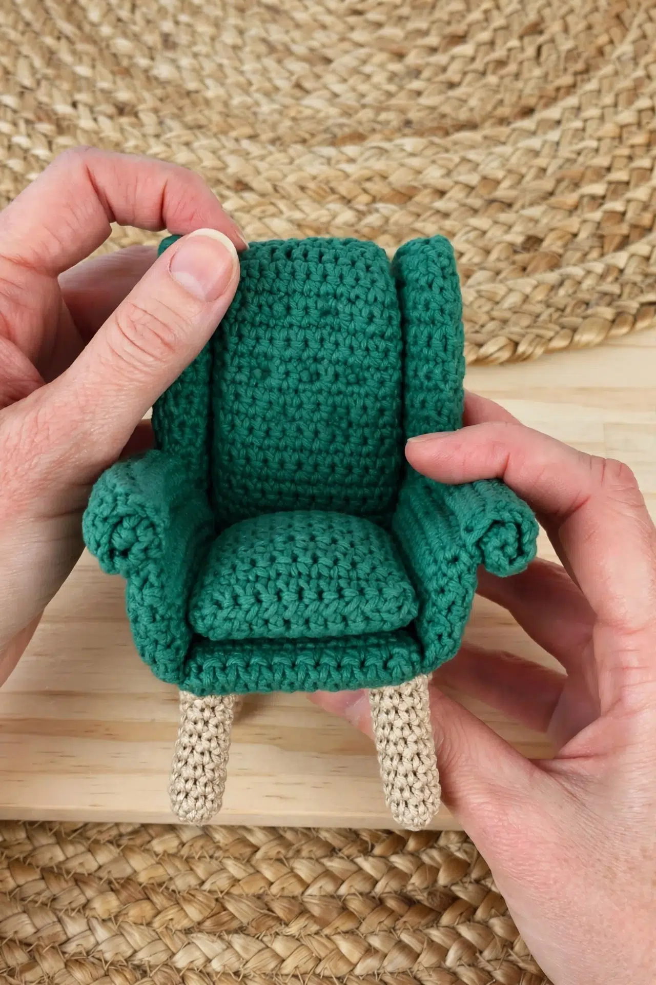 Side angle of the Miniature Crochet Dollhouse Armchair highlights textured crochet stitches