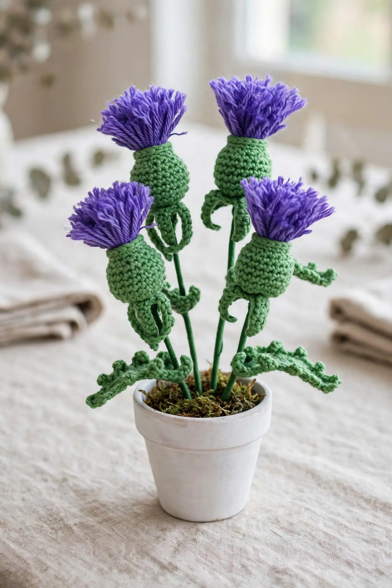 Purple Crochet Thistle Flower showing detailed stitches and textured purple petals