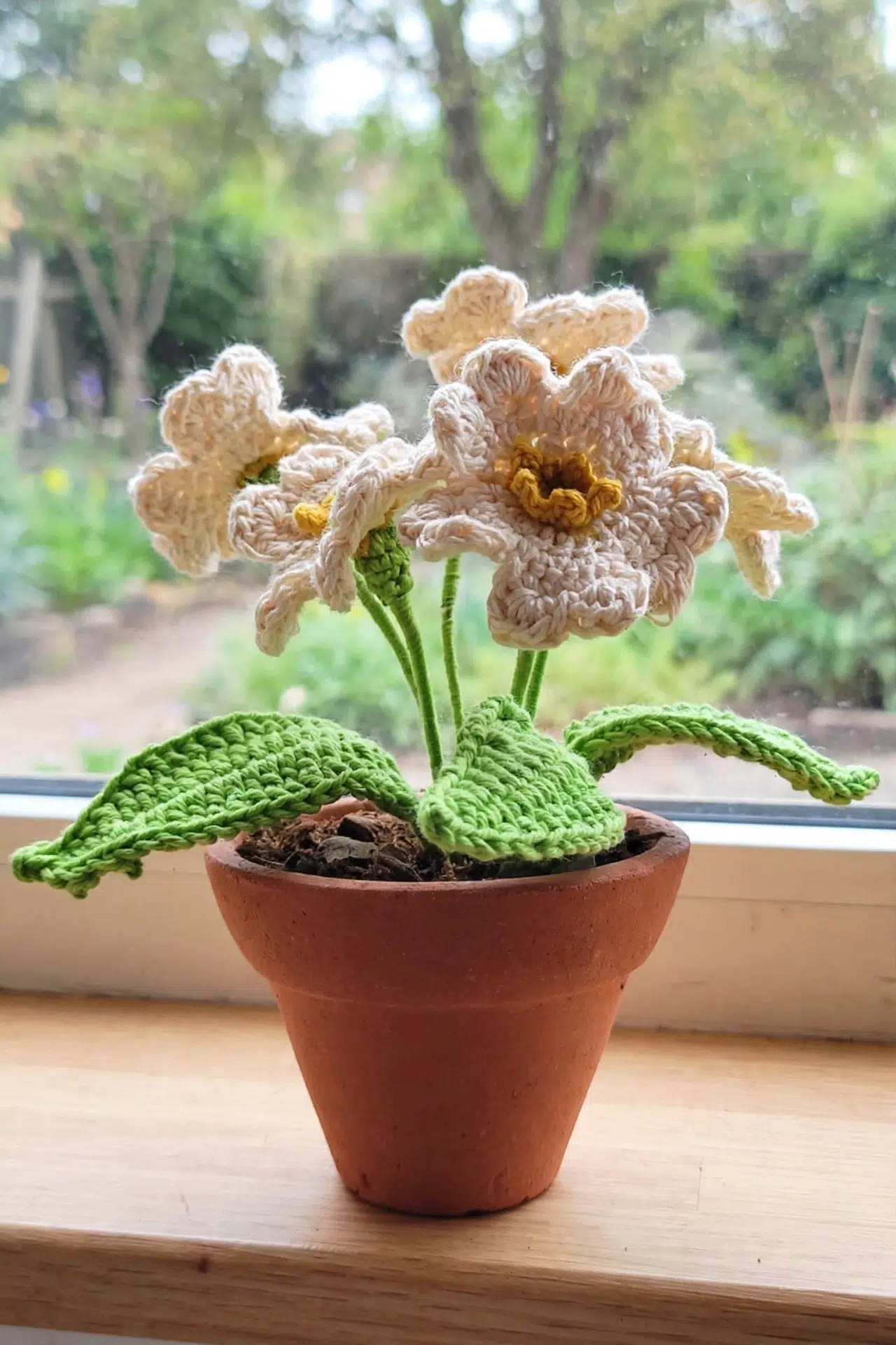 Crochet Primrose Flower displayed as a charming finished floral accent